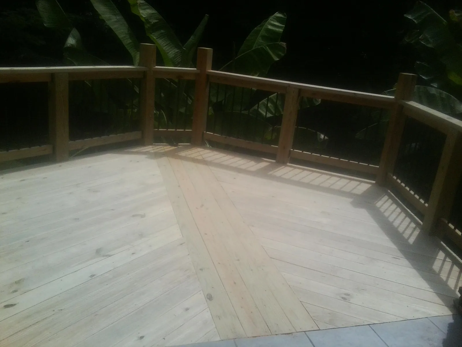 New wood deck and railing built off the back of a home in Lake Havasu City